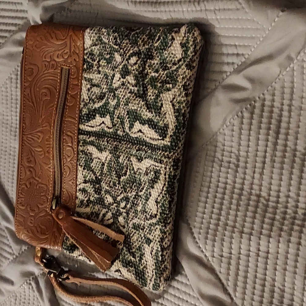 small hand bag brown and blue and white on bottom